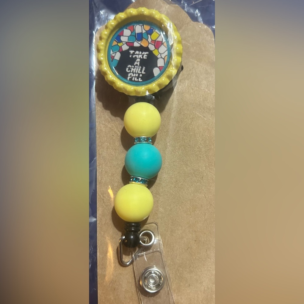 New. Handmade badge reel “Take a Chill Pill”